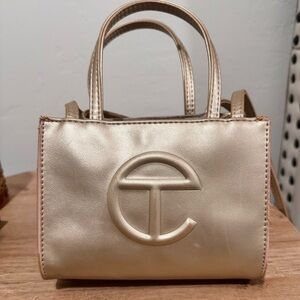Used gold telfar bag